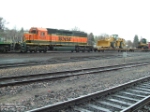 BNSF 6929 SD40-2 leading a front-end loader